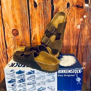 Birkenstock Arizona sandals in suede mocha, featuring ergonomic cork footbed.